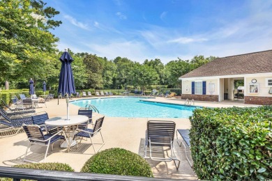Pond and golf course views from the covered porch on this great on Barefoot Resort and Golf Club  in South Carolina - for sale on GolfHomes.com, golf home, golf lot