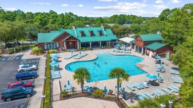 Pond and golf course views from the covered porch on this great on Barefoot Resort and Golf Club  in South Carolina - for sale on GolfHomes.com, golf home, golf lot