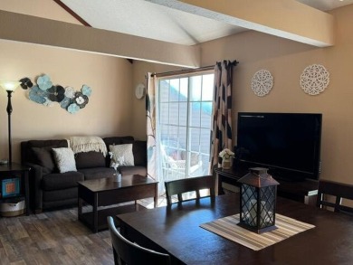 Step into luxury with this fully furnished and updated on Pointe Royale Village Country Club in Missouri - for sale on GolfHomes.com, golf home, golf lot