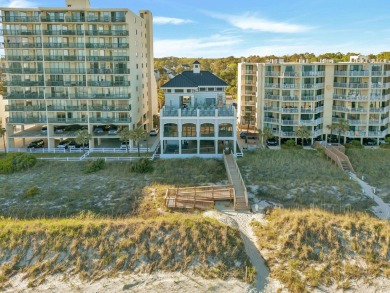 Pond and golf course views from the covered porch on this great on Barefoot Resort and Golf Club  in South Carolina - for sale on GolfHomes.com, golf home, golf lot