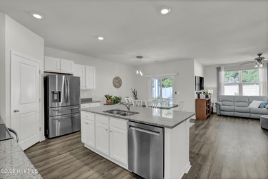 Welcome to this charming cottage with manicured landscaping on Lennon Hills Golf Course in North Carolina - for sale on GolfHomes.com, golf home, golf lot