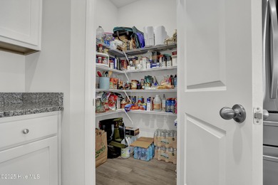 Welcome to this charming cottage with manicured landscaping on Lennon Hills Golf Course in North Carolina - for sale on GolfHomes.com, golf home, golf lot