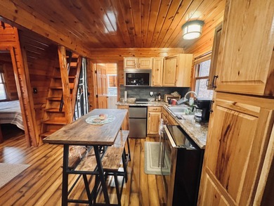 Welcome to 2344 Cabin Cove-your perfect Up North getaway without on The Loon Golf Resort in Michigan - for sale on GolfHomes.com, golf home, golf lot