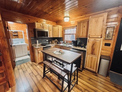 Welcome to 2344 Cabin Cove-your perfect Up North getaway without on The Loon Golf Resort in Michigan - for sale on GolfHomes.com, golf home, golf lot