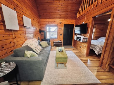 Welcome to 2344 Cabin Cove-your perfect Up North getaway without on The Loon Golf Resort in Michigan - for sale on GolfHomes.com, golf home, golf lot