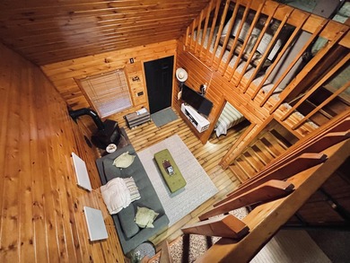 Welcome to 2344 Cabin Cove-your perfect Up North getaway without on The Loon Golf Resort in Michigan - for sale on GolfHomes.com, golf home, golf lot