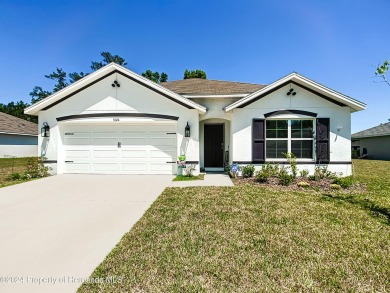 Beautifully maintained 4 bedroom, 2 bathroom home in the gated on Hernando Oaks Golf and Country Club in Florida - for sale on GolfHomes.com, golf home, golf lot