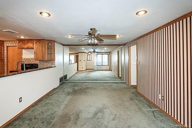 Discover this charming first-floor 2-bedroom condo in the highly on Blue Ridge Golf Club in New York - for sale on GolfHomes.com, golf home, golf lot