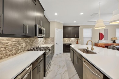 Impeccably Upgraded Piceno Model | 2BR + Den | Outdoor Oasis on Esplanade Golf and Country at Lakewood Ranch in Florida - for sale on GolfHomes.com, golf home, golf lot