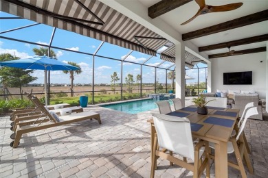 Picture yourself unwinding on your covered western-facing lanai on Calusa Lakes Golf Club in Florida - for sale on GolfHomes.com, golf home, golf lot