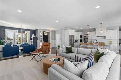 Discover refined living in this former NIH Custom Builders on Rush Creek Golf Club in Minnesota - for sale on GolfHomes.com, golf home, golf lot