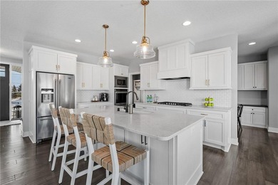 Discover refined living in this former NIH Custom Builders on Rush Creek Golf Club in Minnesota - for sale on GolfHomes.com, golf home, golf lot