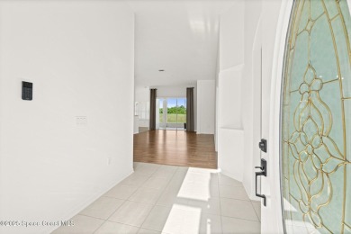 Golf lover's paradise! Nestled in a gated community along the on Viera East Golf Club in Florida - for sale on GolfHomes.com, golf home, golf lot