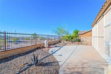 Nestled within the ultra-exclusive, guard-gated enclave of on Laughlin Ranch Golf Club in Arizona - for sale on GolfHomes.com, golf home, golf lot