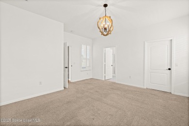 Golf lover's paradise! Nestled in a gated community along the on Viera East Golf Club in Florida - for sale on GolfHomes.com, golf home, golf lot