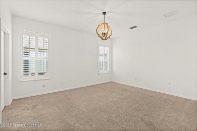 Golf lover's paradise! Nestled in a gated community along the on Viera East Golf Club in Florida - for sale on GolfHomes.com, golf home, golf lot