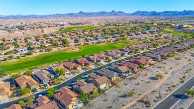 Nestled within the ultra-exclusive, guard-gated enclave of on Laughlin Ranch Golf Club in Arizona - for sale on GolfHomes.com, golf home, golf lot