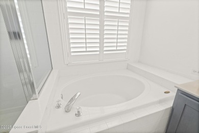 Golf lover's paradise! Nestled in a gated community along the on Viera East Golf Club in Florida - for sale on GolfHomes.com, golf home, golf lot