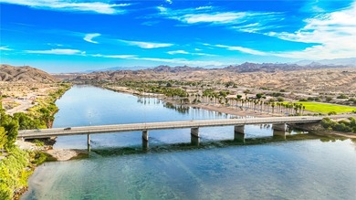 Nestled within the ultra-exclusive, guard-gated enclave of on Laughlin Ranch Golf Club in Arizona - for sale on GolfHomes.com, golf home, golf lot