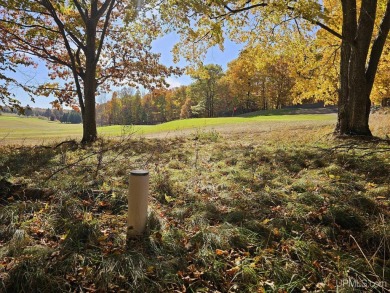 Envision your dream home nestled amidst the serene beauty of the on Garden Golf Course in Michigan - for sale on GolfHomes.com, golf home, golf lot