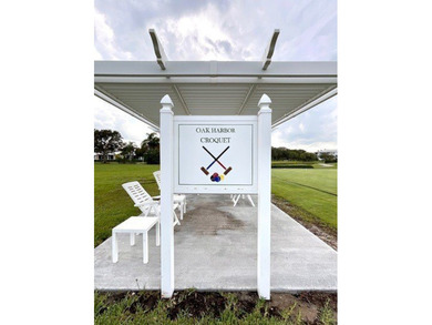 AN INSPIRED RE-DESIGN OF A BEAUTIFULLY UPDATED GOLF COTTAGE at on Oak Harbor Country Club in Florida - for sale on GolfHomes.com, golf home, golf lot