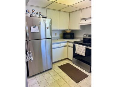 Welcome to 6 Willow Grove Place, a beautiful home nestled in a on The Grand Club - Pine Lakes Course in Florida - for sale on GolfHomes.com, golf home, golf lot