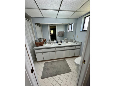 Welcome to 6 Willow Grove Place, a beautiful home nestled in a on The Grand Club - Pine Lakes Course in Florida - for sale on GolfHomes.com, golf home, golf lot