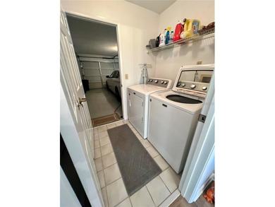 Welcome to 6 Willow Grove Place, a beautiful home nestled in a on The Grand Club - Pine Lakes Course in Florida - for sale on GolfHomes.com, golf home, golf lot