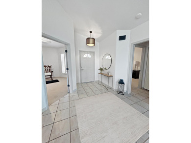 This beautifully renovated single family home features an open on Capri Isle Golf Club in Florida - for sale on GolfHomes.com, golf home, golf lot