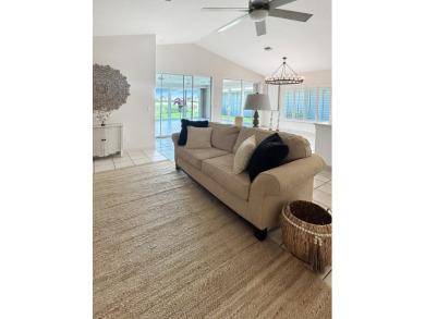 This beautifully renovated single family home features an open on Capri Isle Golf Club in Florida - for sale on GolfHomes.com, golf home, golf lot