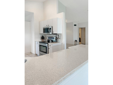 This beautifully renovated single family home features an open on Capri Isle Golf Club in Florida - for sale on GolfHomes.com, golf home, golf lot