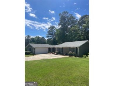 This ranch home is happily situated on a beautiful 1.03-acre lot on Honey Creek Country Club in Georgia - for sale on GolfHomes.com, golf home, golf lot