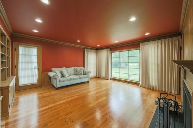 Discover the ease of single-level living with stunning vistas of on Country Club of Detroit - Regulation in Michigan - for sale on GolfHomes.com, golf home, golf lot