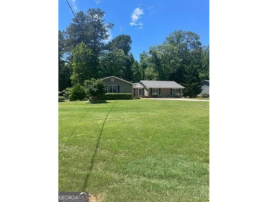 This ranch home is happily situated on a beautiful 1.03-acre lot on Honey Creek Country Club in Georgia - for sale on GolfHomes.com, golf home, golf lot