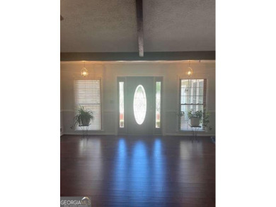 This ranch home is happily situated on a beautiful 1.03-acre lot on Honey Creek Country Club in Georgia - for sale on GolfHomes.com, golf home, golf lot
