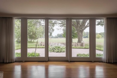 Discover the ease of single-level living with stunning vistas of on Country Club of Detroit - Regulation in Michigan - for sale on GolfHomes.com, golf home, golf lot