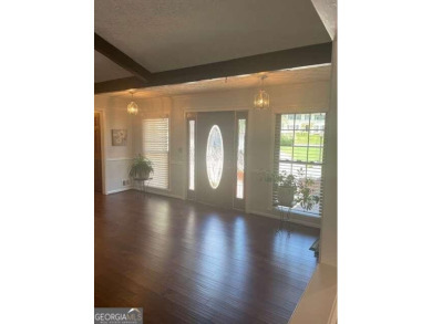 This ranch home is happily situated on a beautiful 1.03-acre lot on Honey Creek Country Club in Georgia - for sale on GolfHomes.com, golf home, golf lot