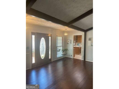 This ranch home is happily situated on a beautiful 1.03-acre lot on Honey Creek Country Club in Georgia - for sale on GolfHomes.com, golf home, golf lot
