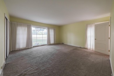Discover the ease of single-level living with stunning vistas of on Country Club of Detroit - Regulation in Michigan - for sale on GolfHomes.com, golf home, golf lot