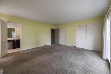 Discover the ease of single-level living with stunning vistas of on Country Club of Detroit - Regulation in Michigan - for sale on GolfHomes.com, golf home, golf lot