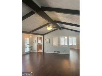 This ranch home is happily situated on a beautiful 1.03-acre lot on Honey Creek Country Club in Georgia - for sale on GolfHomes.com, golf home, golf lot