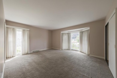 Discover the ease of single-level living with stunning vistas of on Country Club of Detroit - Regulation in Michigan - for sale on GolfHomes.com, golf home, golf lot