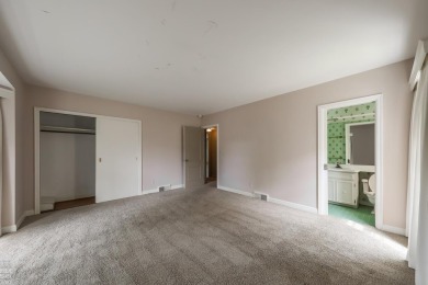 Discover the ease of single-level living with stunning vistas of on Country Club of Detroit - Regulation in Michigan - for sale on GolfHomes.com, golf home, golf lot
