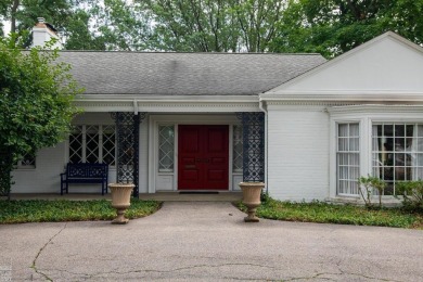 Discover the ease of single-level living with stunning vistas of on Country Club of Detroit - Regulation in Michigan - for sale on GolfHomes.com, golf home, golf lot