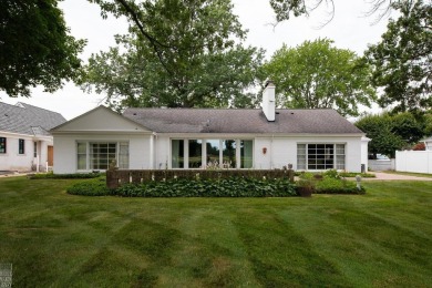Discover the ease of single-level living with stunning vistas of on Country Club of Detroit - Regulation in Michigan - for sale on GolfHomes.com, golf home, golf lot