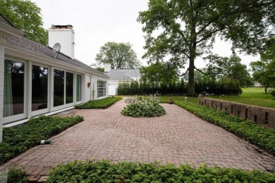 Discover the ease of single-level living with stunning vistas of on Country Club of Detroit - Regulation in Michigan - for sale on GolfHomes.com, golf home, golf lot