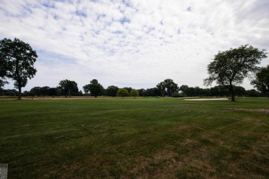 Discover the ease of single-level living with stunning vistas of on Country Club of Detroit - Regulation in Michigan - for sale on GolfHomes.com, golf home, golf lot