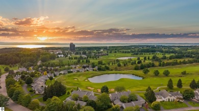 Experience luxury living on the 11th fairway of The Bear Golf on Grand Traverse Resort and Spa in Michigan - for sale on GolfHomes.com, golf home, golf lot