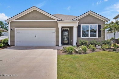 Easy living in this one level home with lawncare included! This on Cape Fear National At Brunswick Forest in North Carolina - for sale on GolfHomes.com, golf home, golf lot