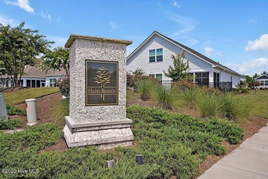 Easy living in this one level home with lawncare included! This on Cape Fear National At Brunswick Forest in North Carolina - for sale on GolfHomes.com, golf home, golf lot